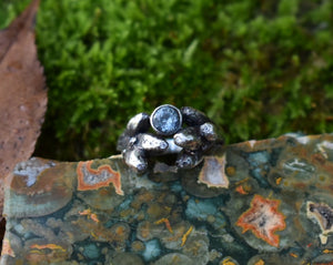 silver oak ring with half carat color-change sapphire and 9 colorless diamonds