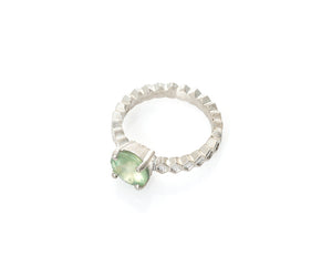 prehnite honeycomb ring in silver, flower cut prehnite, flower cut gem, honeycomb jewelry, peggy skemp jewelry, solitaire ring with green stone and hand engraved gem seat, four prong setting