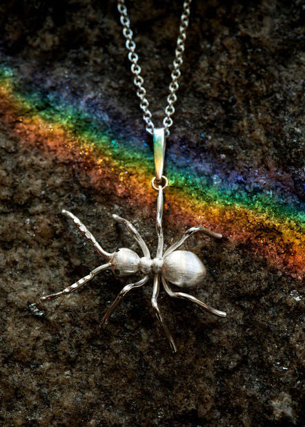 realistic silver ant pendant by Peggy Skemp in silver with black diamond eyes