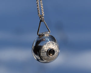 Anatomical eyeball picture locket with black star sapphire