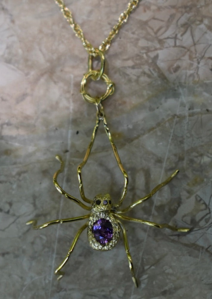 18ky gld spider pendant with color-change sapphire, black diamond eyes