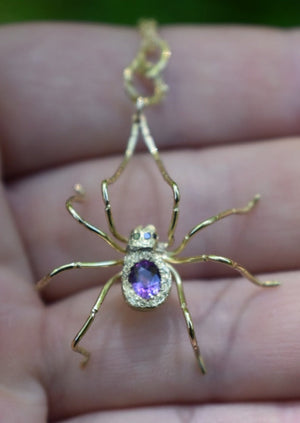 18ky gld spider pendant with color-change sapphire, black diamond eyes