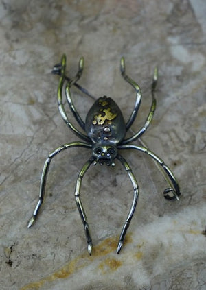 Detailed spider brooch, garden spider with black diamond eyes, silver palps, hand engraved silver legs, with 18ky, 14k white and 14k rose gold details on the body.