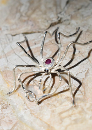 Silver spider with ruby, hand engraved body and black diamond eyes