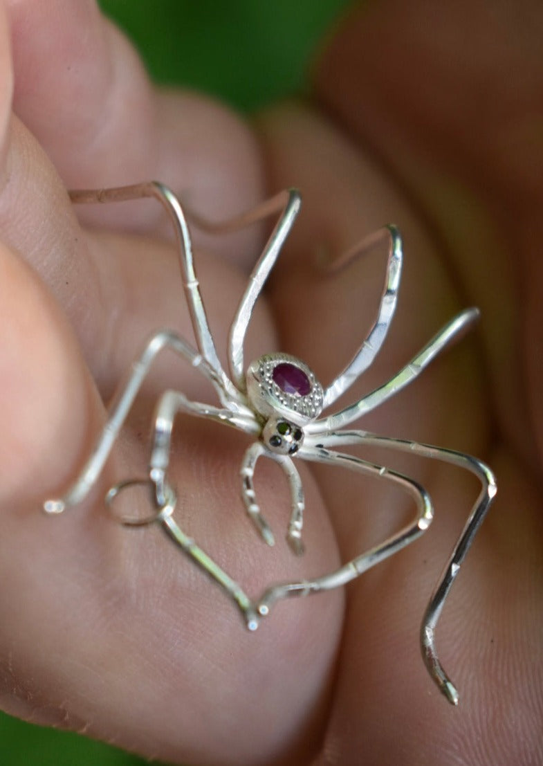 Silver spider pendant with ruby, hand engraved body and black diamond eyes