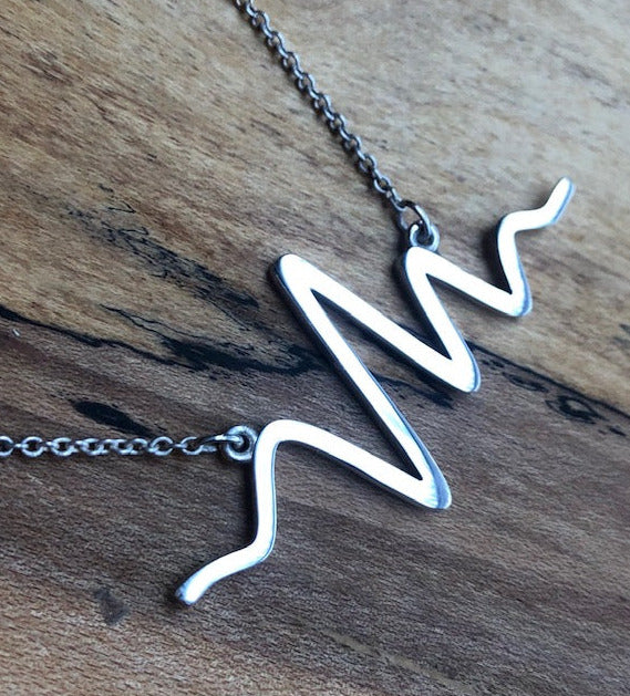 Silver eeg brain wave necklace by Peggy Skemp 2"x1"x 2mm