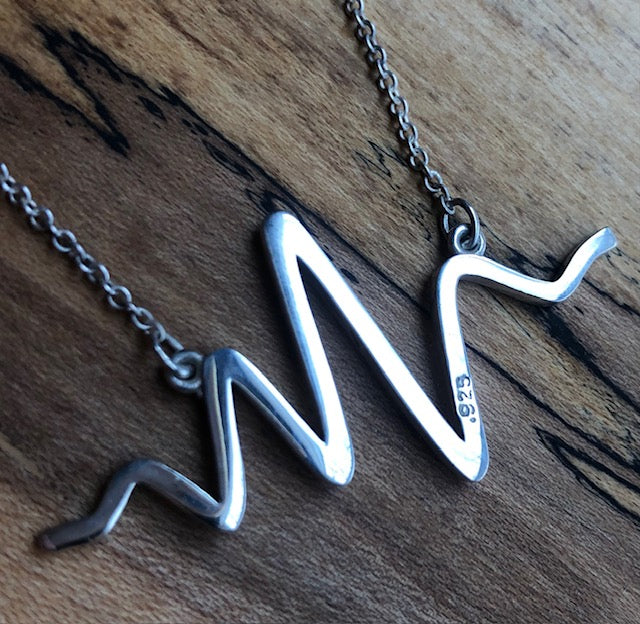 Silver eeg brain wave necklace by Peggy Skemp 2"x1"x 2mm