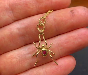 18ky gold spider with 2mm ruby and 18ky spun gold web