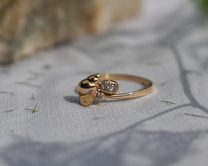 14k rose gold 14kr shell with 3 1.5mm diamonds, 1.5mm band, size 5 3/4. Solid gold handmade ring by Peggy Skemp 2021. This piece would make a subtle, comfy engagement ring or gift for you- can be stacked with simple rose gold band for beautiful, simple look.