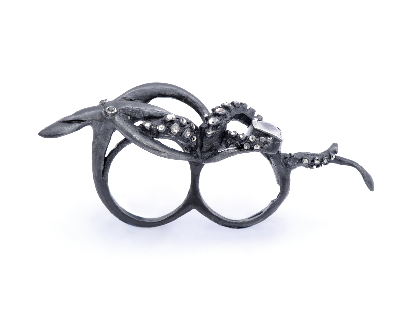 Squid two-finger ring by Peggy Skemp set with briolette cut rainbow moonstone, black diamond eyes. Photo by Rachel Hanel, Chicago, IL