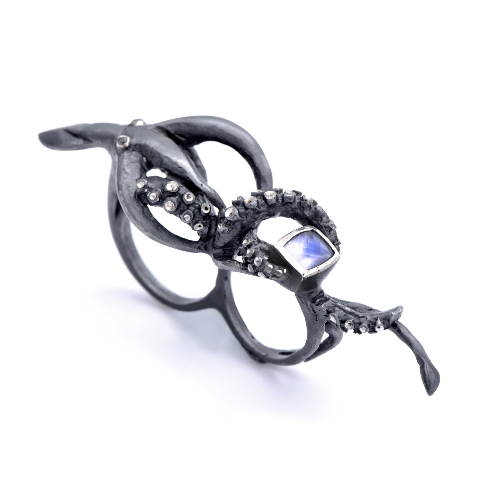 Squid two-finger ring by Peggy Skemp set with briolette cut rainbow moonstone, black diamond eyes. Photo by Rachel Hanel, Chicago, IL