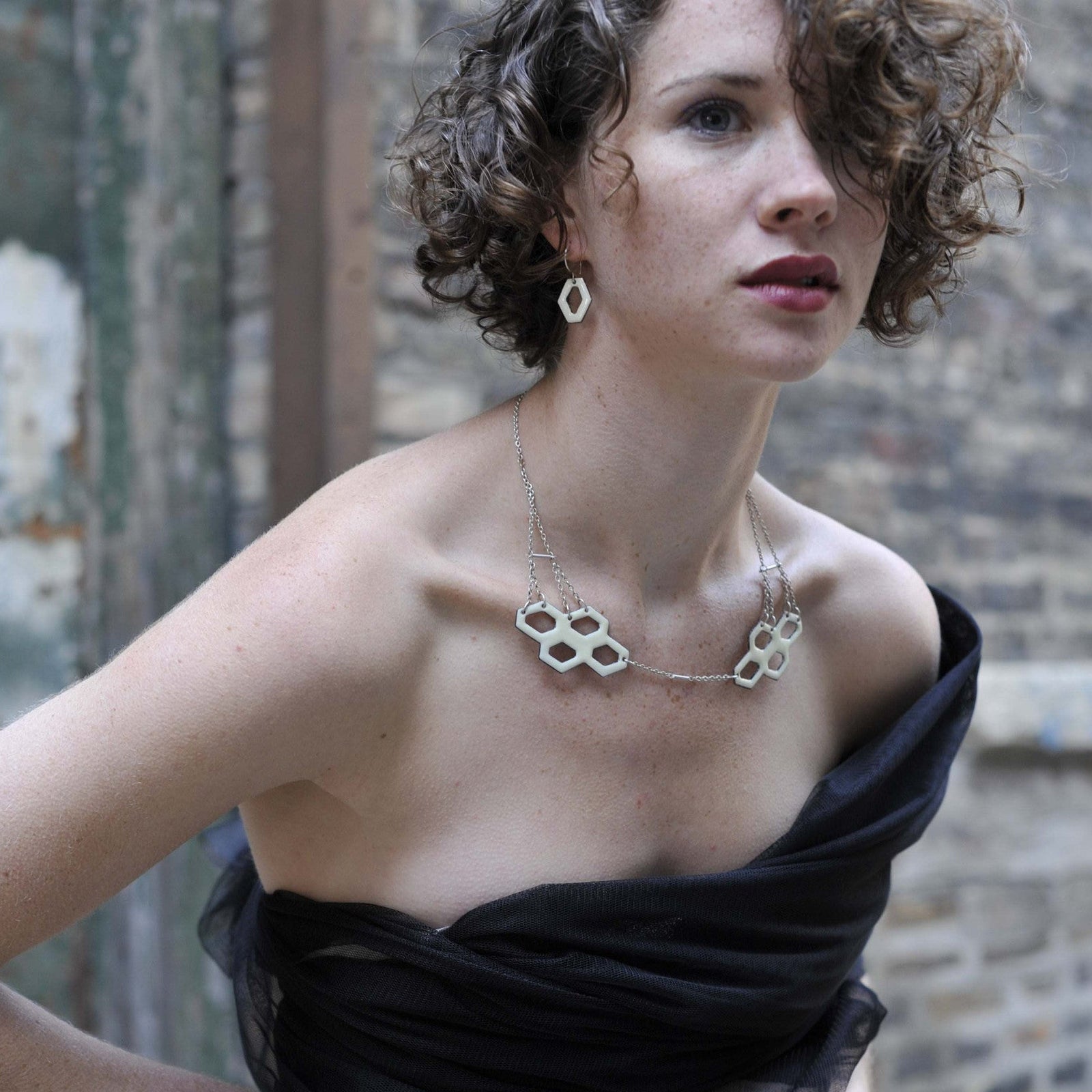 Enamelled Hive Collar and Hive Cell earrings, copper, silver and hot glass enamel, sculptural art jewelry  by PEggy Skemp 2009, Photo by Rachel Hanel, Model Colleen Skemp