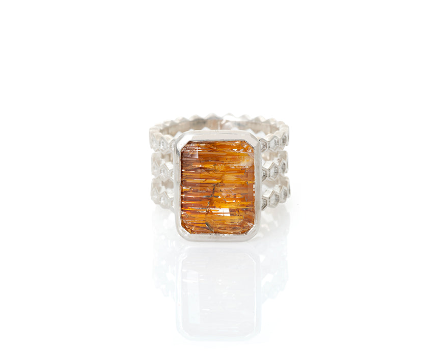 Emerald cut, rutilated topaz, topaz, faceted topaz, rutile, included topaz, included gemstone, gem collector, peggy skemp jewelry, jewelry addict