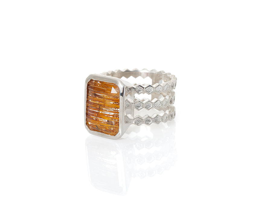 Emerald cut, rutilated topaz, topaz, faceted topaz, rutile, included topaz, included gemstone, gem collector, peggy skemp jewelry, jewelry addict