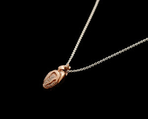 Tiny anatomical heart necklace in carnation pink silver with polished silver chain by Peggy Skemp.