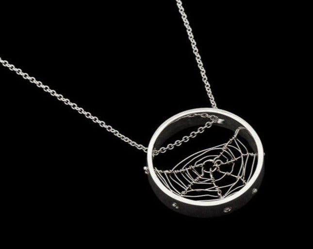 Circle shaped spiderweb, hand-woven and twined by Peggy Skemp