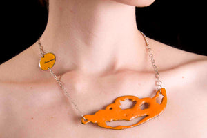 Orange sugar fired vitreous enamel on copper, glass enamel phasmid necklace by Peggy Skemp 2008 from the Sensitive Parasite collection.
