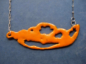 Orange sugar fired vitreous enamel on copper, glass enamel phasmid necklace by Peggy Skemp 2008 from the Sensitive Parasite collection.