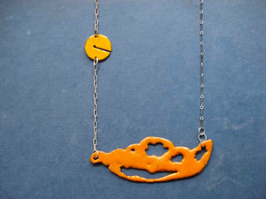 Orange sugar fired vitreous enamel on copper, glass enamel phasmid necklace by Peggy Skemp 2008 from the Sensitive Parasite collection.